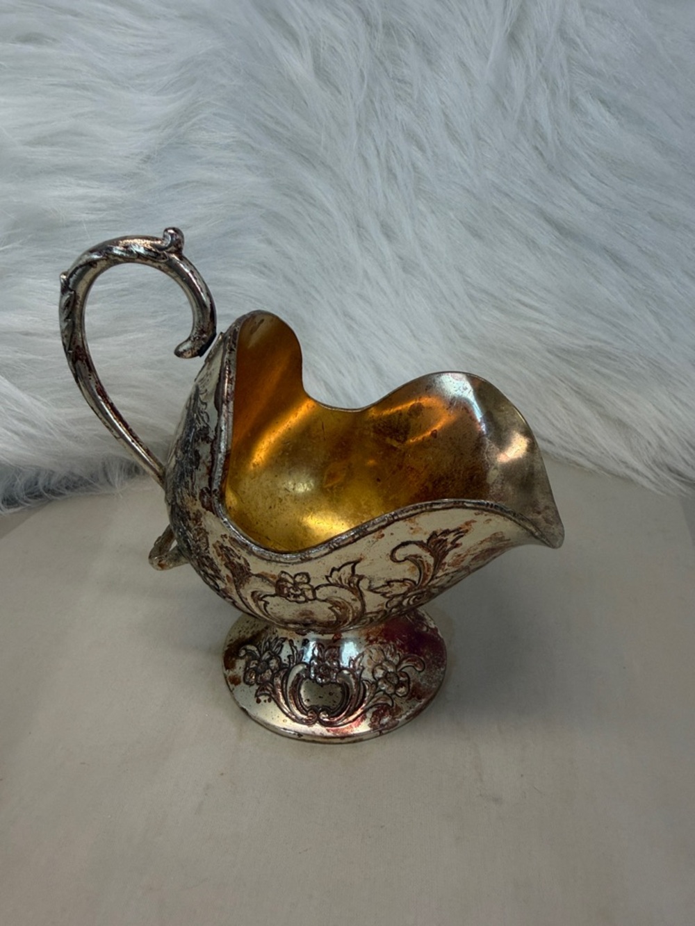 Vintage silver plated sugar scuttle with ornate floral embossing and gold wash